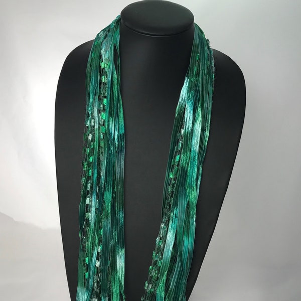 Italian Ladder Ribbon Scarf, with Rich Shades of Emerald Green. These scarves are a great addition to any wardrobe.
