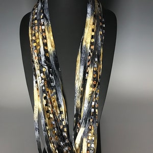 Italian Ladder Ribbon Scarf, Black,Gold and Silver, Elegant color combination.  These scarves are a great addition to any wardrobe.