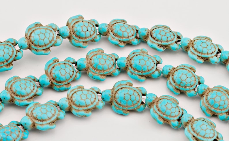 One Strand Howlite Turquoise Carved Two-sided Sea Turtle With Charm Spacer Beads