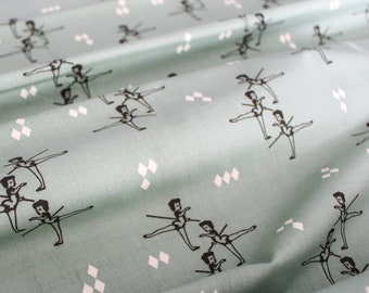 May include: Light teal fabric with a repeating pattern of black ballerina figures in various poses. White diamond shapes are scattered throughout the design. The fabric has a soft, flowing appearance.