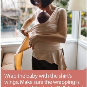 May include: A person wearing a light beige baby wrap, holding a baby. The wrap is being secured around the baby's body. The image includes text that reads: "Wrap the baby with the shirt's wings. Make sure the wrapping is snug around the body. Pull the rest of the material around your body."