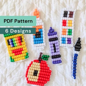 May include: Six beaded craft designs including a yellow pencil box, a glue bottle, a purple crayon, a paint palette, a paintbrush, and a red apple. The text PDF Pattern 6 Designs is overlaid on the image. These items are made from small plastic beads.