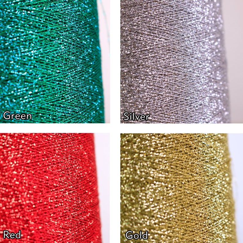 May include: Close-up of four spools of glitter thread in green, silver, red, and gold. Each spool is labelled with its colour. The thread is tightly wound, and the glitter catches the light, creating a sparkling effect.