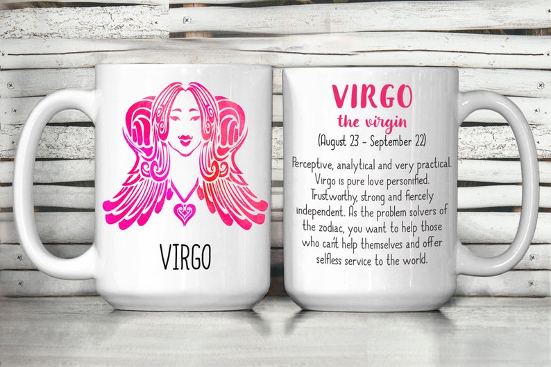 May include: White ceramic mug with a pink and white design of the Virgo zodiac sign. The mug has a handle and the text "VIRGO the virgin (August 23 - September 22)" is printed on the side. The text below reads "Perceptive, analytical and very practical. Virgo is pure love personified. Trustworthy, strong and fiercely independent. As the problem solvers of the zodiac, you want to help those who can't help themselves and offer selfless service to the world."