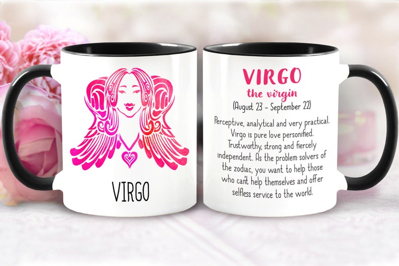 May include: White ceramic mug with a black handle and rim. The mug features a pink and red stylized image of the Virgo zodiac sign with the word "VIRGO" printed below. The opposite side of the mug has the text "VIRGO the virgin (August 23 - September 22)" and a description of the Virgo personality.