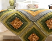 Dandelion Dance Afghan hand knitted from Drops Nepal wool and alpaca yarn mix.