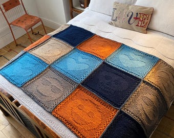 Emoji Afghan hand knitted using rough farm wool. 5 emoji patterns knitted in square motifs and joined in one piece.Granny square afghan.