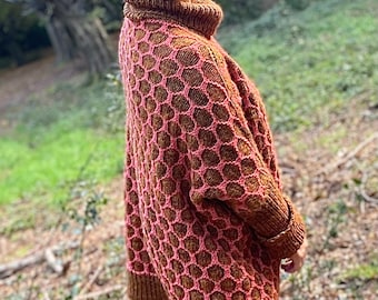 Oversized hand knit pullover,tunic,jersey.Loose-fitting body,drop shoulders,high rolled neck,sleeves with fold-back cuffs.Honeycomb pattern.