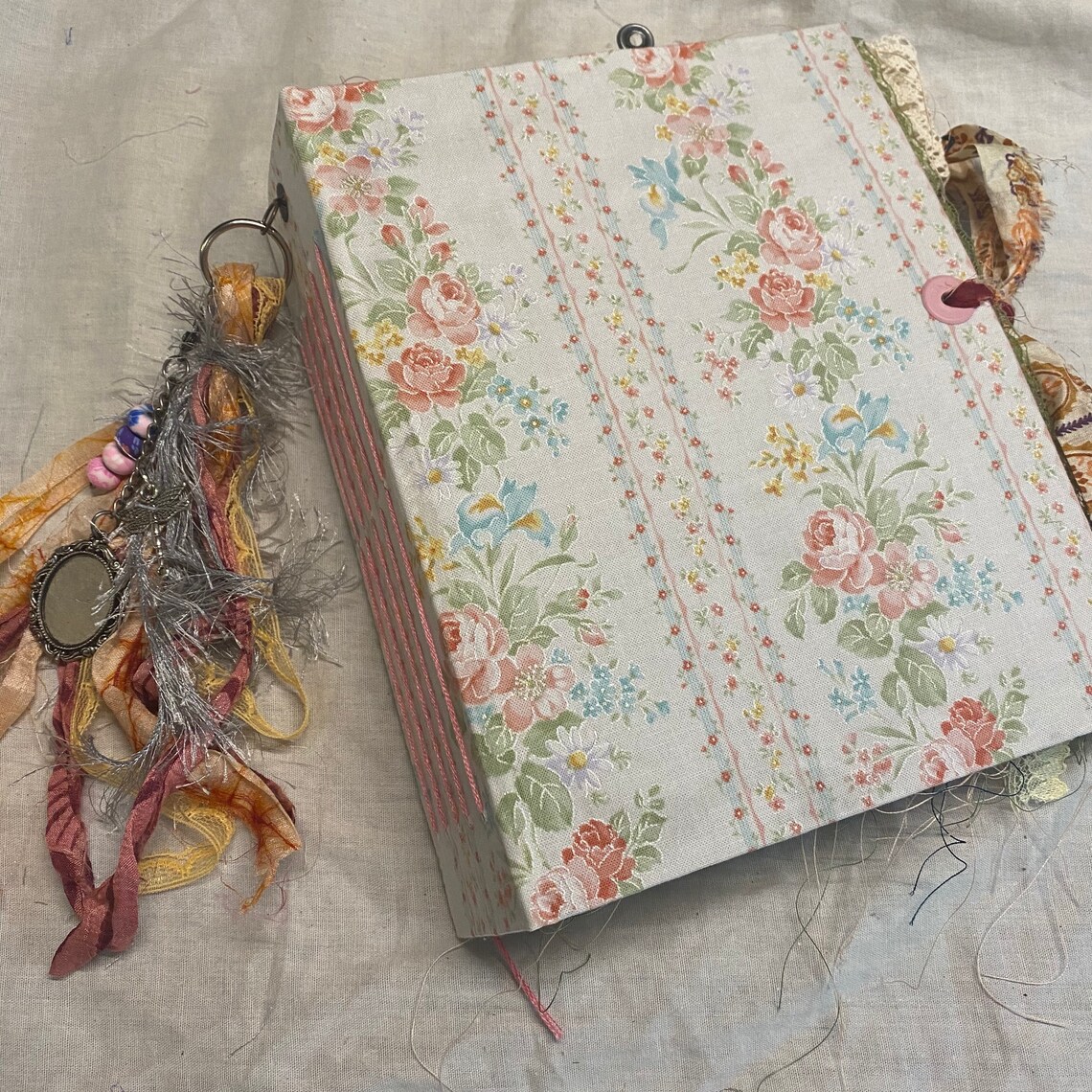 Vintage floral fabric junk journal with tassle and charm / Etsy
