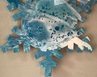 This 21" x 25" oversized hand painted indoor snowflake ornament will brighten up your winter blues!