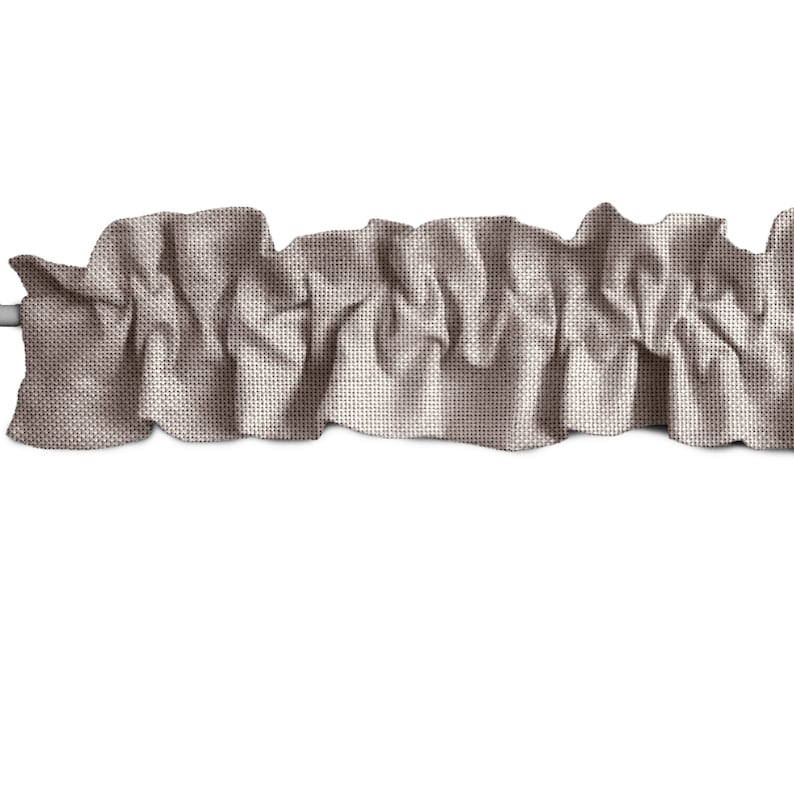 May include: A brown fabric valance with a ruffled edge. The valance is made of a textured fabric and is perfect for adding a touch of elegance to any window.