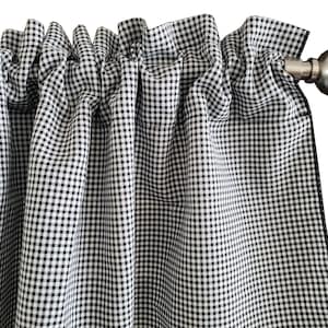 May include: Black and white gingham valance with a ruffled top and black trim. The valance is hung on a silver curtain rod.