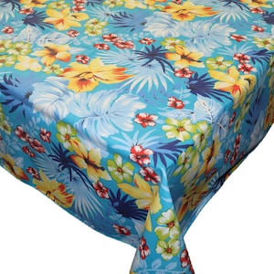May include: A blue tablecloth with a tropical floral print featuring yellow, red, green, and white flowers and leaves.