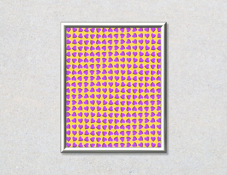 May include: A framed print with a yellow background and a pattern of purple hearts.