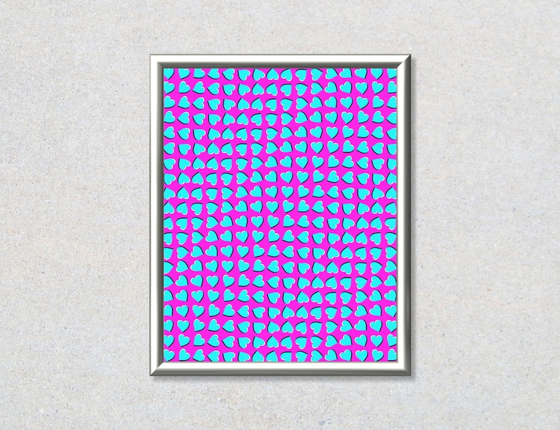 May include: A framed print with a pink background and a pattern of blue hearts. The hearts are arranged in a repeating pattern, creating an optical illusion.