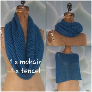 May include: A teal blue mohair and tencel infinity scarf and matching poncho. The scarf is shown on a mannequin and the poncho is shown on a separate mannequin.