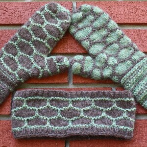 May include: Three knitted mittens in brown and green with a geometric pattern. The mittens are arranged in a triangular shape.