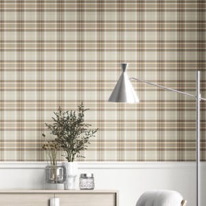 May include: Neutral-toned plaid wallpaper in beige, tan, and brown creates a classic look. The wall is decorated with a white trim and a modern silver lamp. A wooden cabinet holds decorative vases and a glass jar.