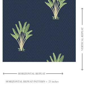 May include: Navy blue wallpaper with a repeating pattern of green banana leaves and a dark blue chevron background. The horizontal repeat pattern is 23 inches, and the vertical repeat pattern is 17.11 inches.