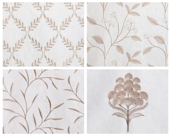 May include: Four different fabric swatches with embroidered floral patterns in shades of brown on a white background.
