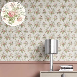 May include: Wallpaper with a repeating pattern of pink roses and green leaves on a cream backdrop. A circular inset displays a close-up of the floral arrangement. The wallpaper covers the wall above a pink painted section and a light-coloured cabinet.