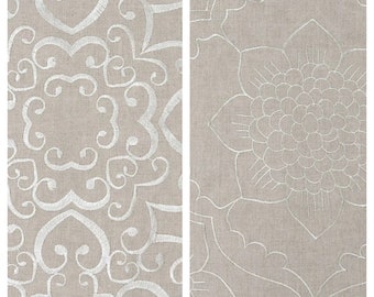 May include: Two fabric swatches with embroidered designs. The left swatch features a white, intricate, swirling pattern on a beige background. The right swatch features a white, stylized flower design on a beige background.