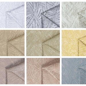Puede incluir: Nueve muestras de tela con un patrón geométrico texturizado. Las muestras son en varios tonos de blanco, gris, beige, marrón y azul.