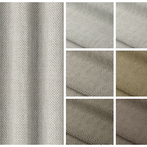 May include: A close-up of a herringbone fabric swatch in various colors, including gray, beige, brown, and black. The fabric has a subtle texture and a classic herringbone pattern.