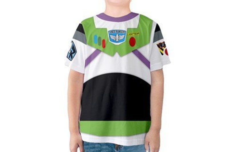 May include: White short-sleeved t-shirt with a printed design of Buzz Lightyear's space ranger suit. The design includes the words "Space Ranger" and "Lightyear" and features a green, black, and purple color scheme.