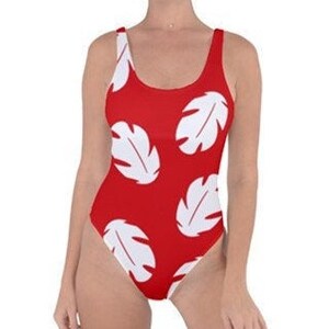 May include: Red one-piece swimsuit with a white tropical leaf pattern.