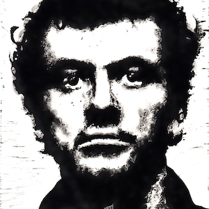 May include: A black and white portrait of a person with dark hair and a beard. The image is a close-up of the person's face, with a focus on the eyes and mouth. The style is artistic, with a textured, almost painted appearance.
