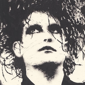 May include: Black and white ink drawing of a person with long, dark hair. The person's face is visible and they are looking upwards.
