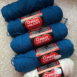 May include: Four skeins of Red Heart sport weight 3-ply yarn. Three skeins are a solid deep teal blue color, and one skein features a variegated pastel pattern with thin stripes of pink, yellow, green, and blue on a white base.