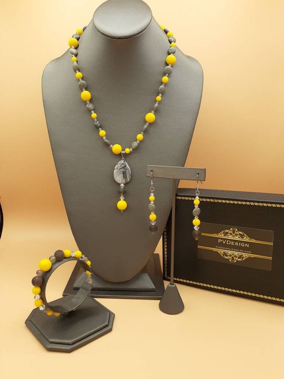 Asymmetric labradorite and yellow jade colors for 2021