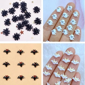 May include: Assortment of Halloween-themed embellishments, including black spiders, bats, and white ghosts. The embellishments are small and perfect for adding a spooky touch to crafts and decorations.