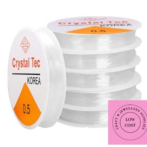 May include: Four spools of clear elastic string, each labelled "Crystal Tec Korea 0.5".