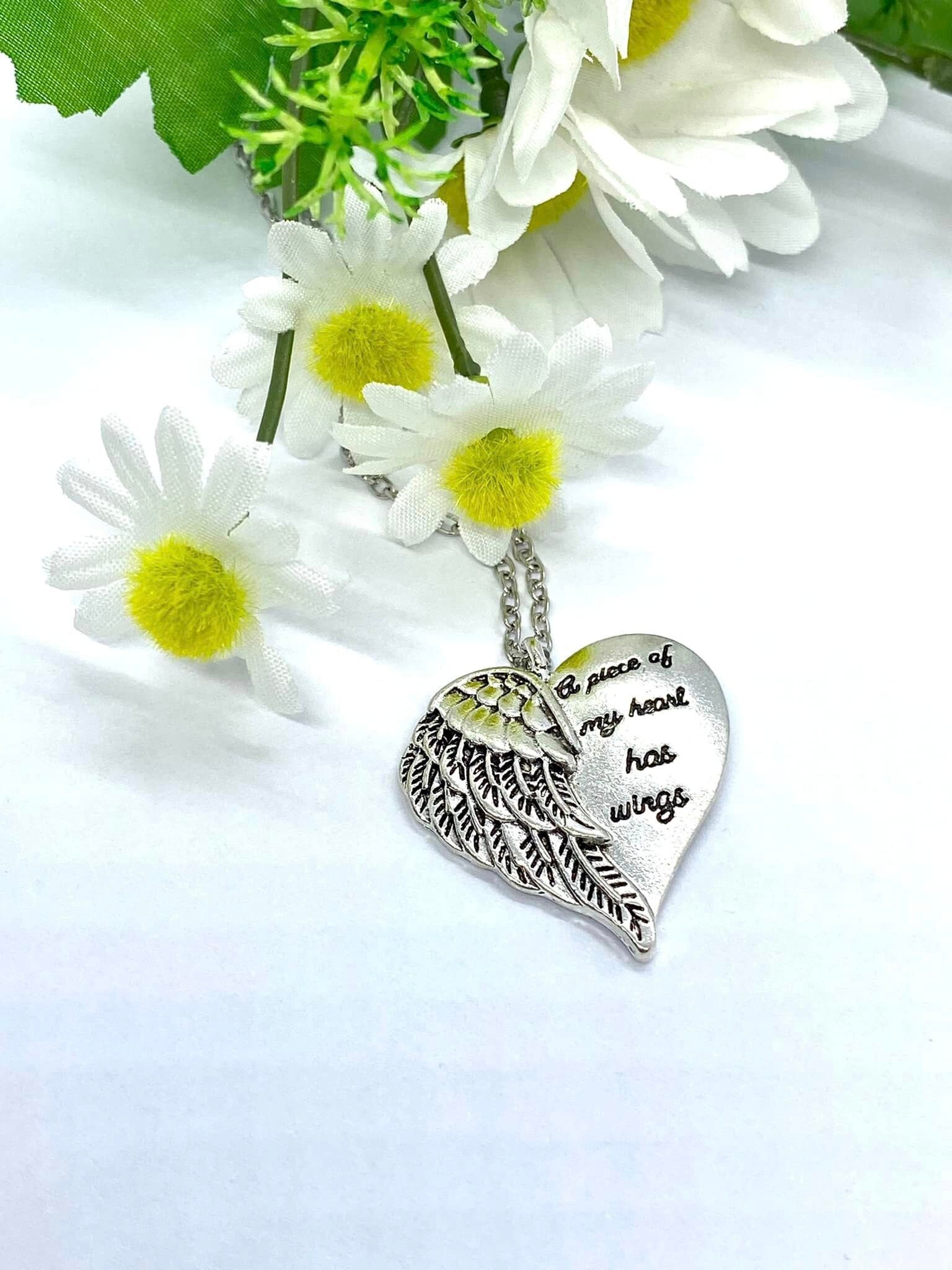 A piece of my sale heart has wings necklace