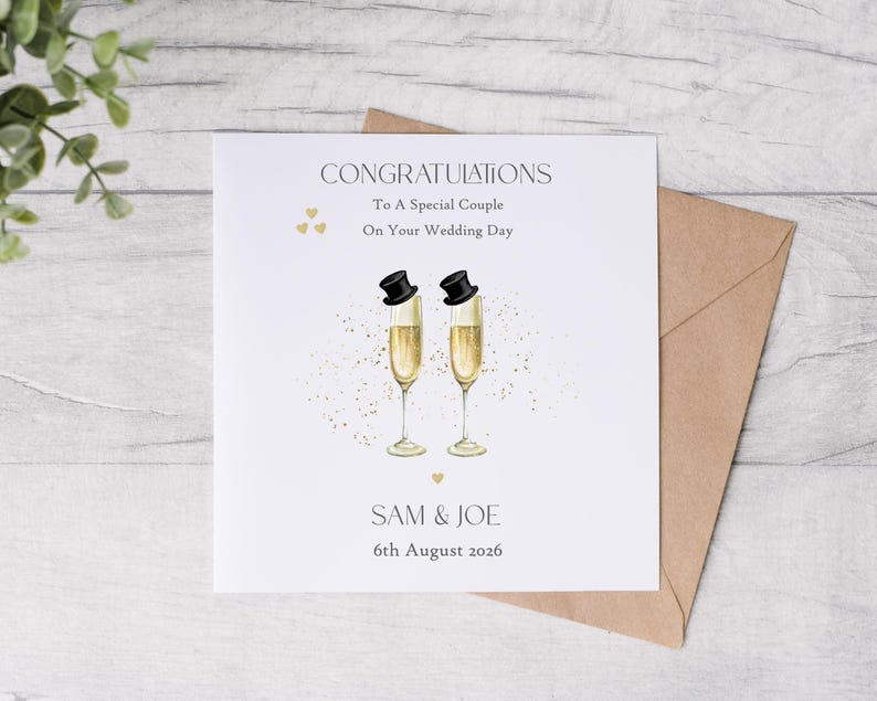 May include: A wedding card with the words "CONGRATULATIONS" and "To A Special Couple On Your Wedding Day". Two champagne flutes with top hats are featured. The names "SAM & JOE" and the date "6th August 2026" are also included.
