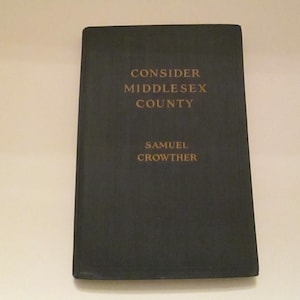 May include: A handmade wooden sign with the text "Welcome to our home" in a handwritten style. The sign is painted white with black lettering and a distressed finish, measuring approximately 12 inches wide and 6 inches tall.