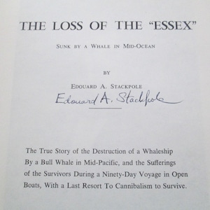 May include: An open book page with the title "THE LOSS OF THE 'ESSEX'" in large, bold text. Below, the text reads "SUNK BY A WHALE IN MID-OCEAN." The author's name, Edouard A. Stackpole, is also visible.
