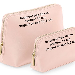 May include: Two pink zippered cosmetic bags with gold zippers. The larger bag measures 23 cm long, 16 cm high, and 10.3 cm wide. The smaller bag measures 18 cm long, 11 cm high, and 4.5 cm wide.