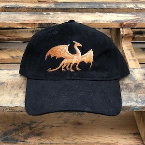 Embroidered twill ball cap with dragon. Your choice of colors.