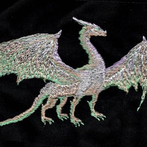 May include: Embroidered design of a silver dragon with green wings on a black background.