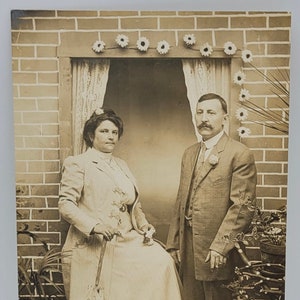 Window & Brick Backdrop~RPPC Couple Posed in the Studio~Creative Props~Woman with Parasol