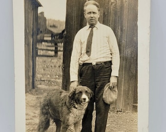 Loyal Friend~Dog & Man~RPPC~Farm Setting~Barnwood~Horse in Background