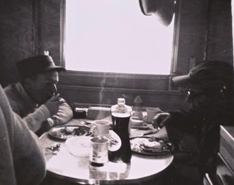 Steaming Cup of Coffee Vintage Polaroid Photo: Two Men Having Breakfast
