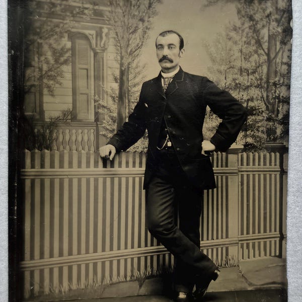 Man Posed by "Picket Fence" Tintype Photo, Studio Backdrop Trees & Portico