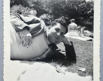 Man Kicking Back in the Grass Vintage Photo Smoking from a Pack of Chesterfield's