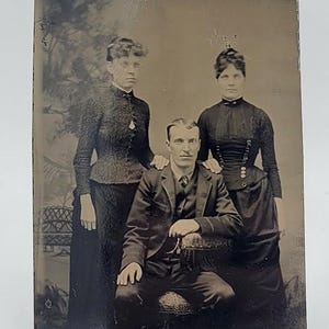 Tintype Photo Two Women and Man~Posed in Studio~Victorian Dresses