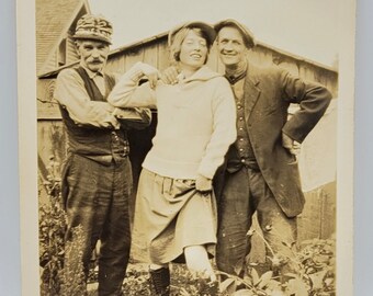 Fun Pose~Vintage Photo~Outdoors in the Flowers~Two Men and a Woman All Wearing Caps